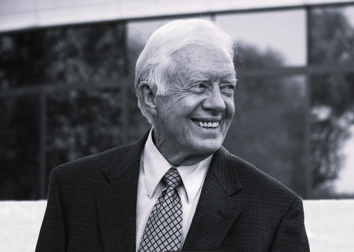 black and white smiling image of former president Jimmy Carter