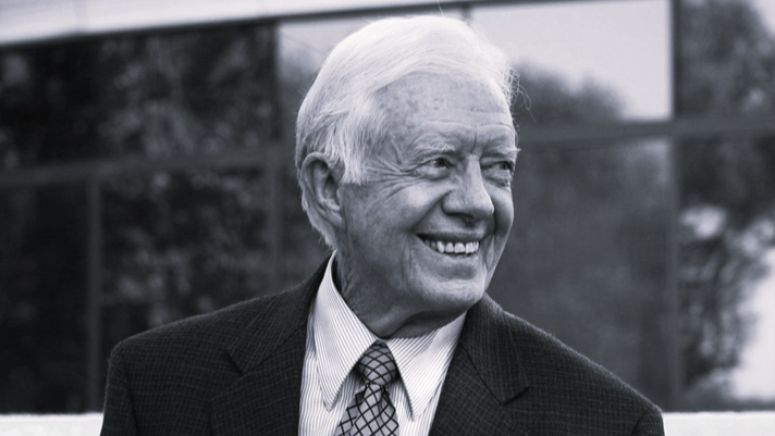 Jimmy Carter smiles in a black and white photo